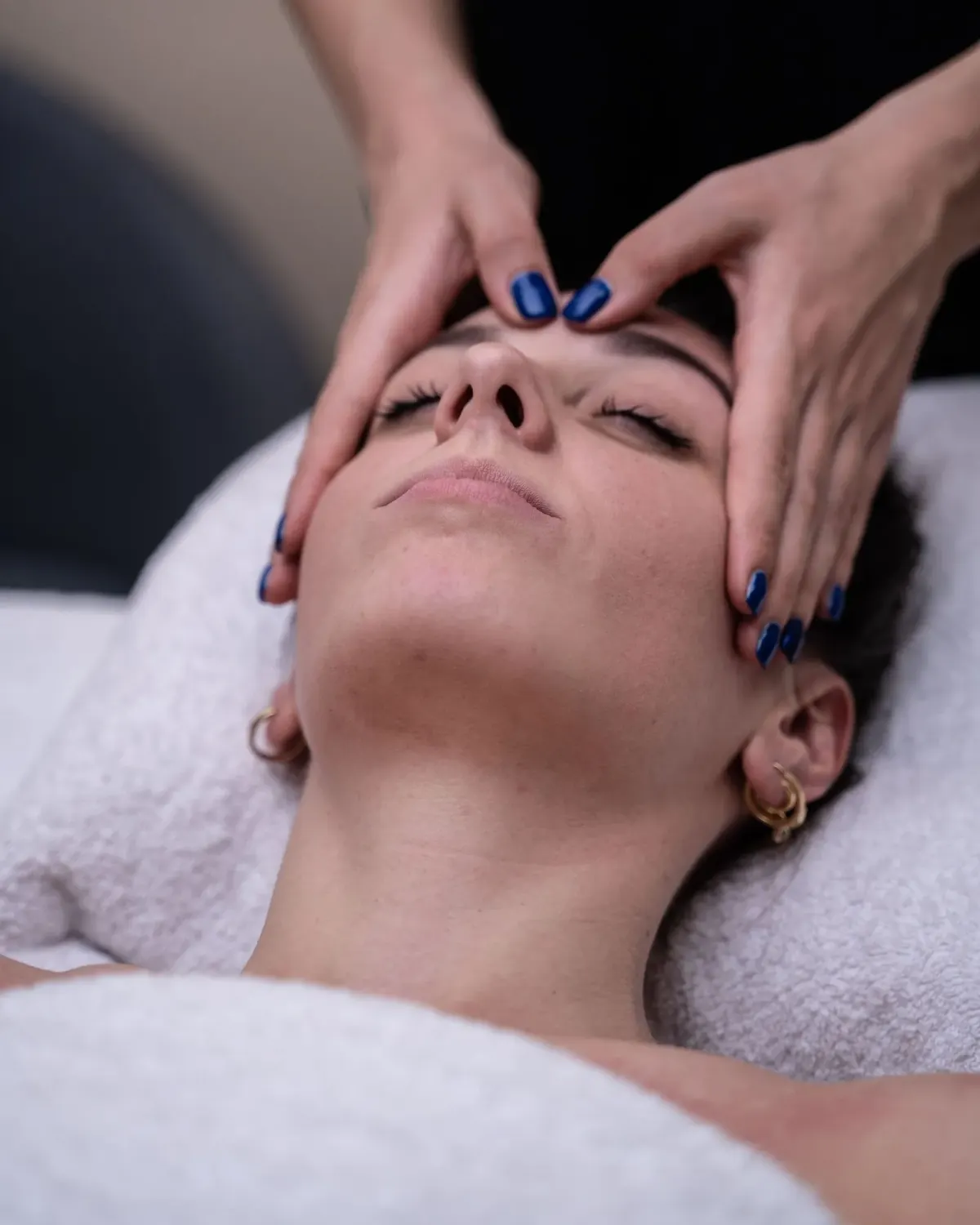 Forehead and temple massage easing tension headaches, studio in Belgrade
